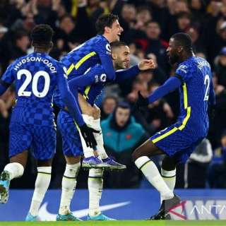 Chelsea players celebrate goal against Tottenham Hotspur at Stamford Bridge Stadium in London.